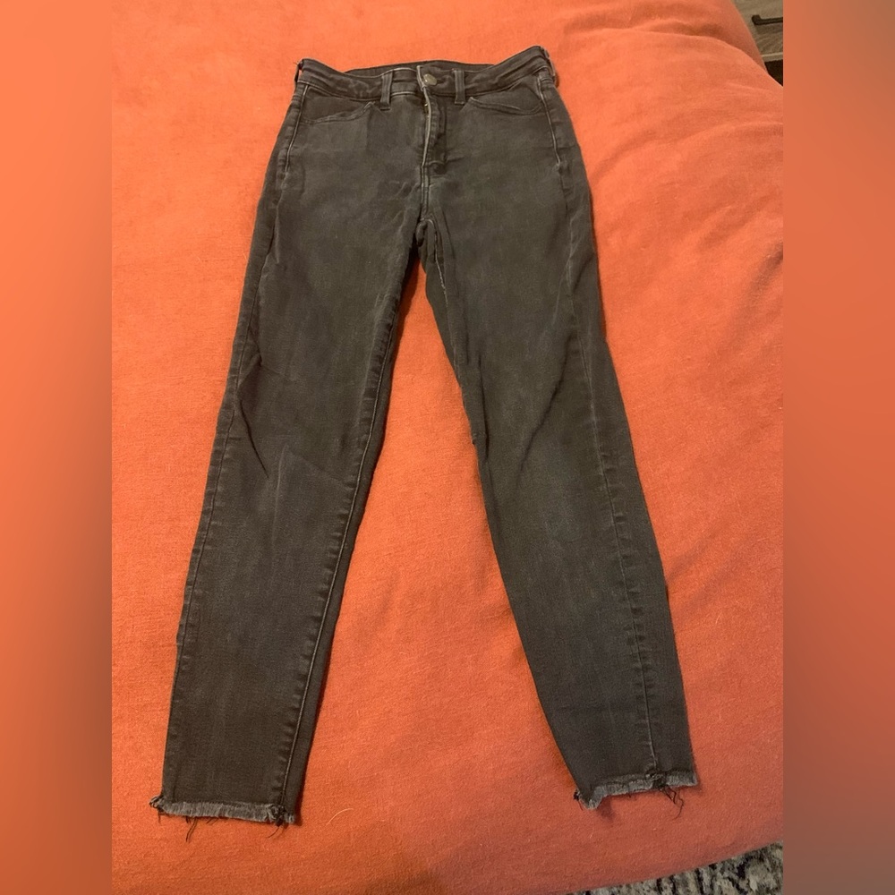 Black high waisted AE jeans with raw hem